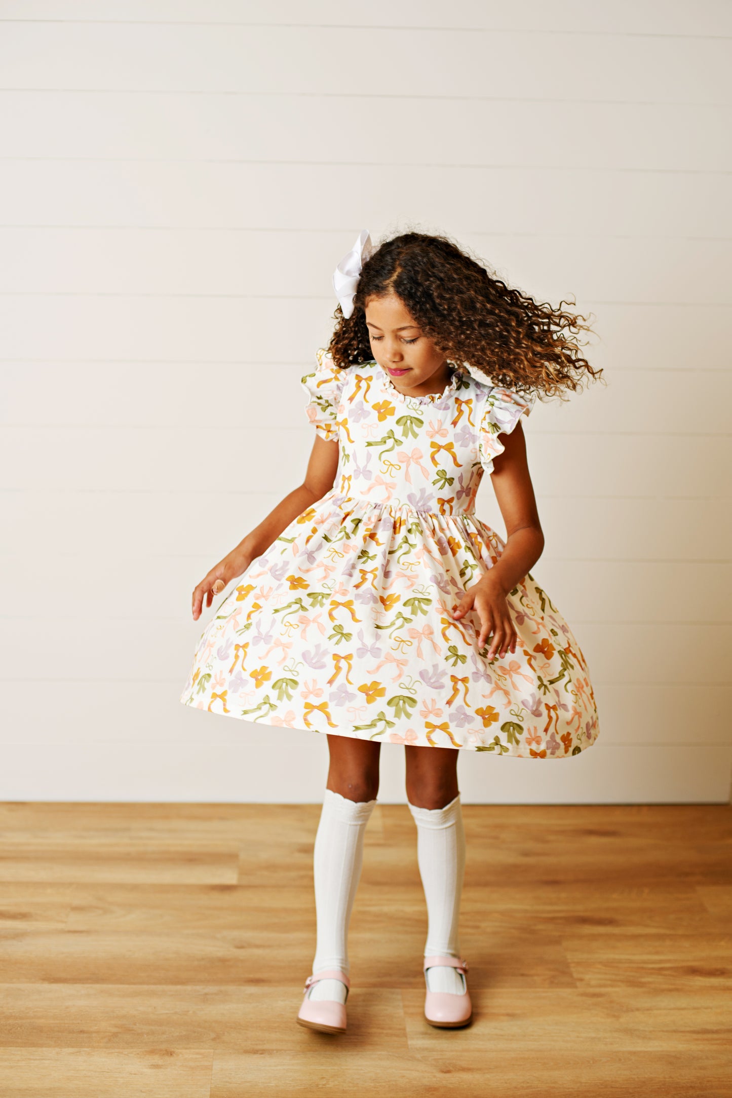 Swoon Baby Girls Flutter Dress - Bows Print