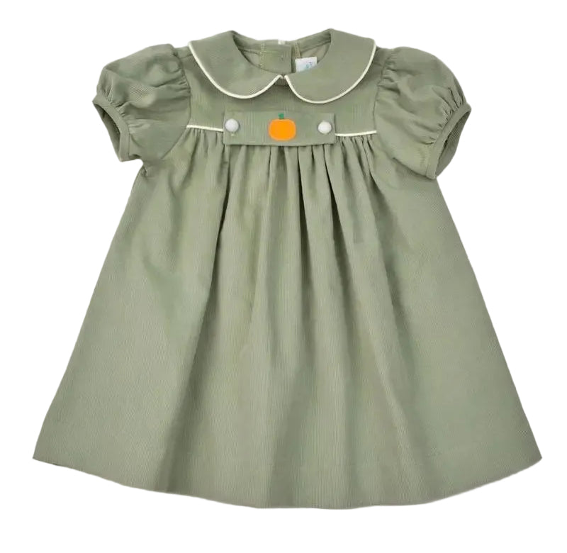 A toddler girl's sage green dress with short puff sleeves, a Peter Pan collar, and a removable pumpkin on the front.