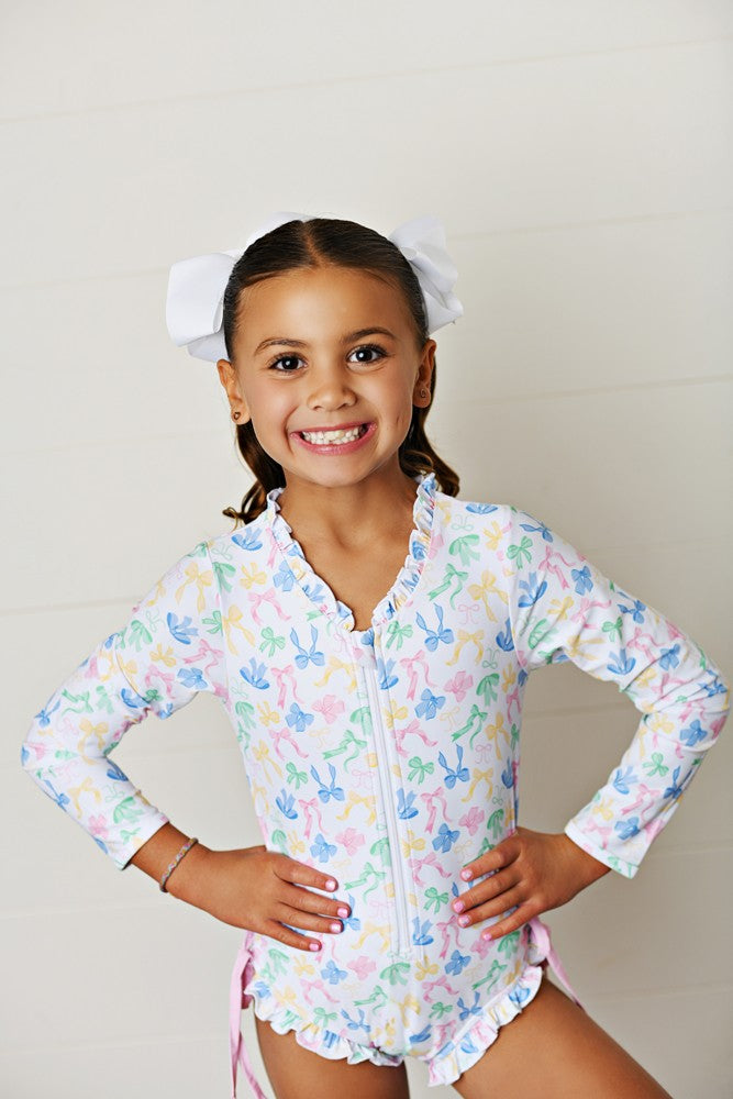 Swoon Baby Girls Pastel Bows Zip Front Rash Guard Swimsuit