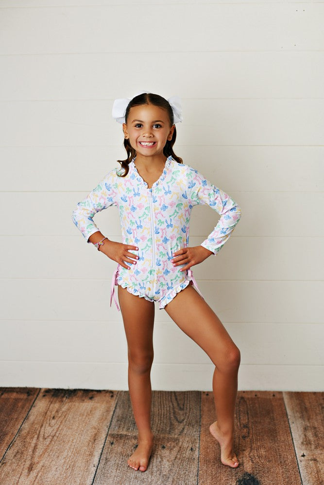 Swoon Baby Girls Pastel Bows Zip Front Rash Guard Swimsuit
