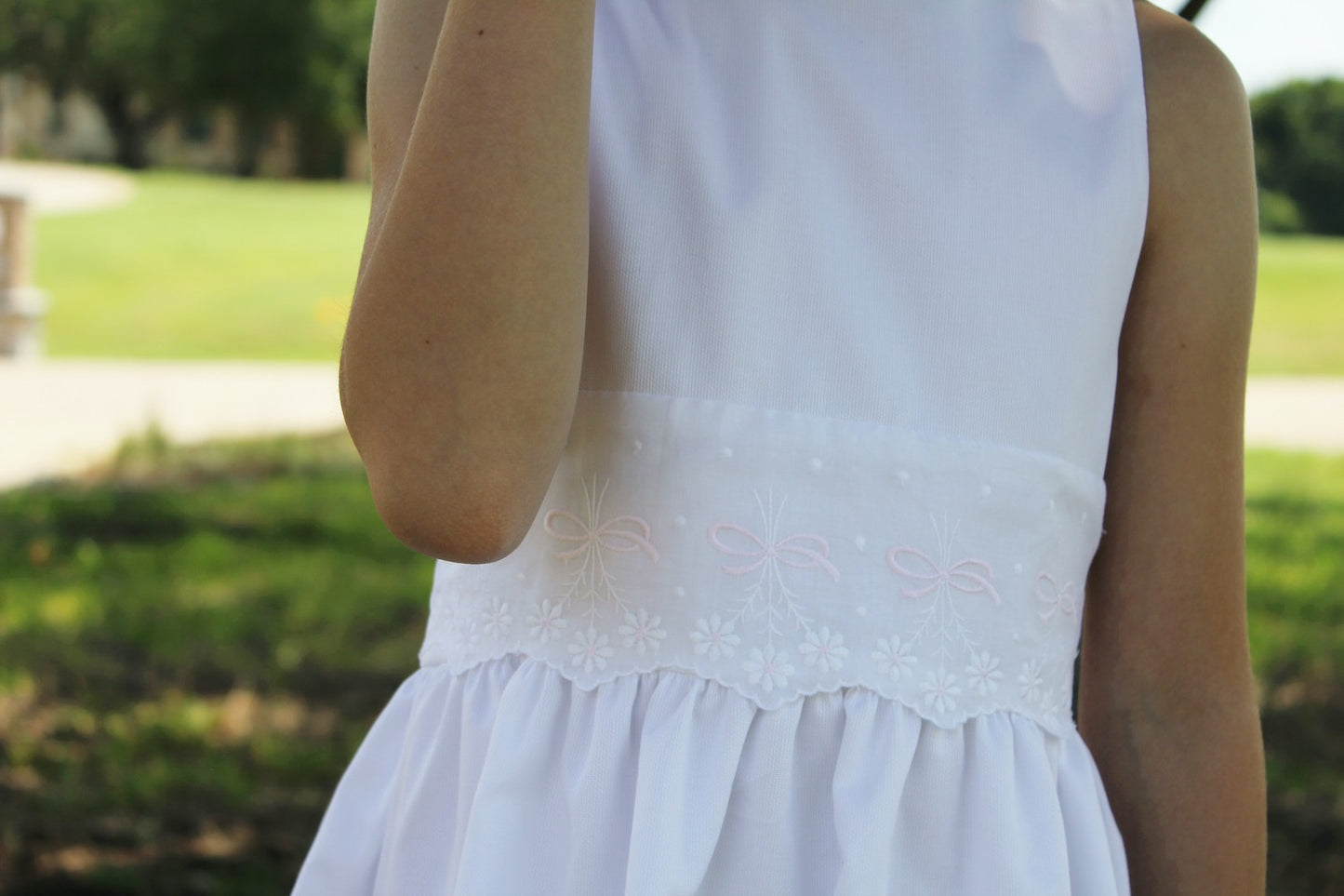 Susanne Lively Girls Sleeveless White Pique Dress with Embroidered Eyelet Waist