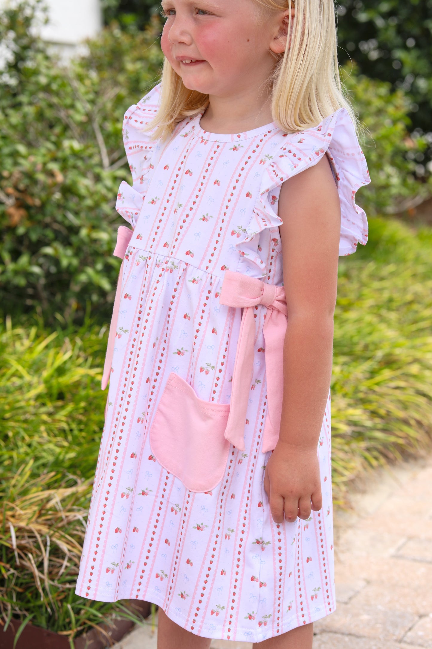Trotter Street Kids Girls Pink Berry Sweet Pinafore Dress - Bows at Sides by Trotter Street Kids