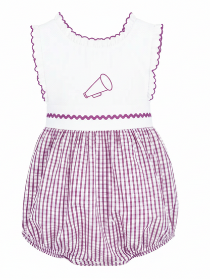 A sleeveless baby romper with a white top featuring puprle scalloped trim and a small purple megaphone graphic, paired with an purple and white gingham patterned bloomers section.