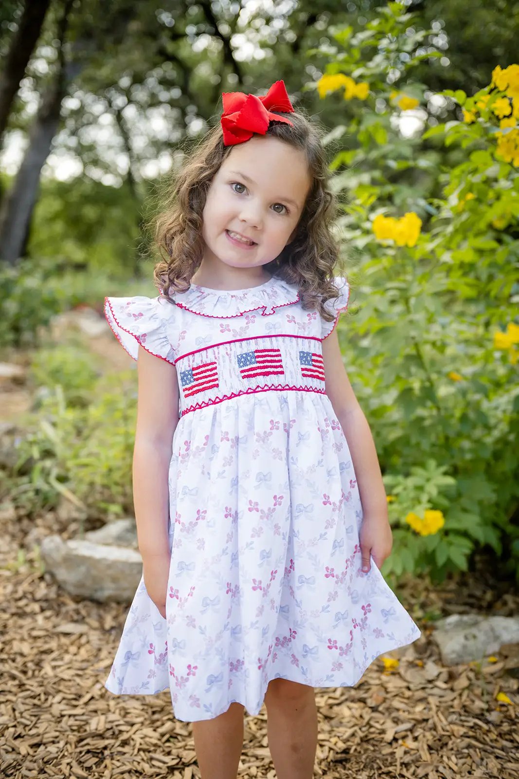 Shop Teeta Girls Ally Dress - Patriotic Bows Print - Smocked USA Flags