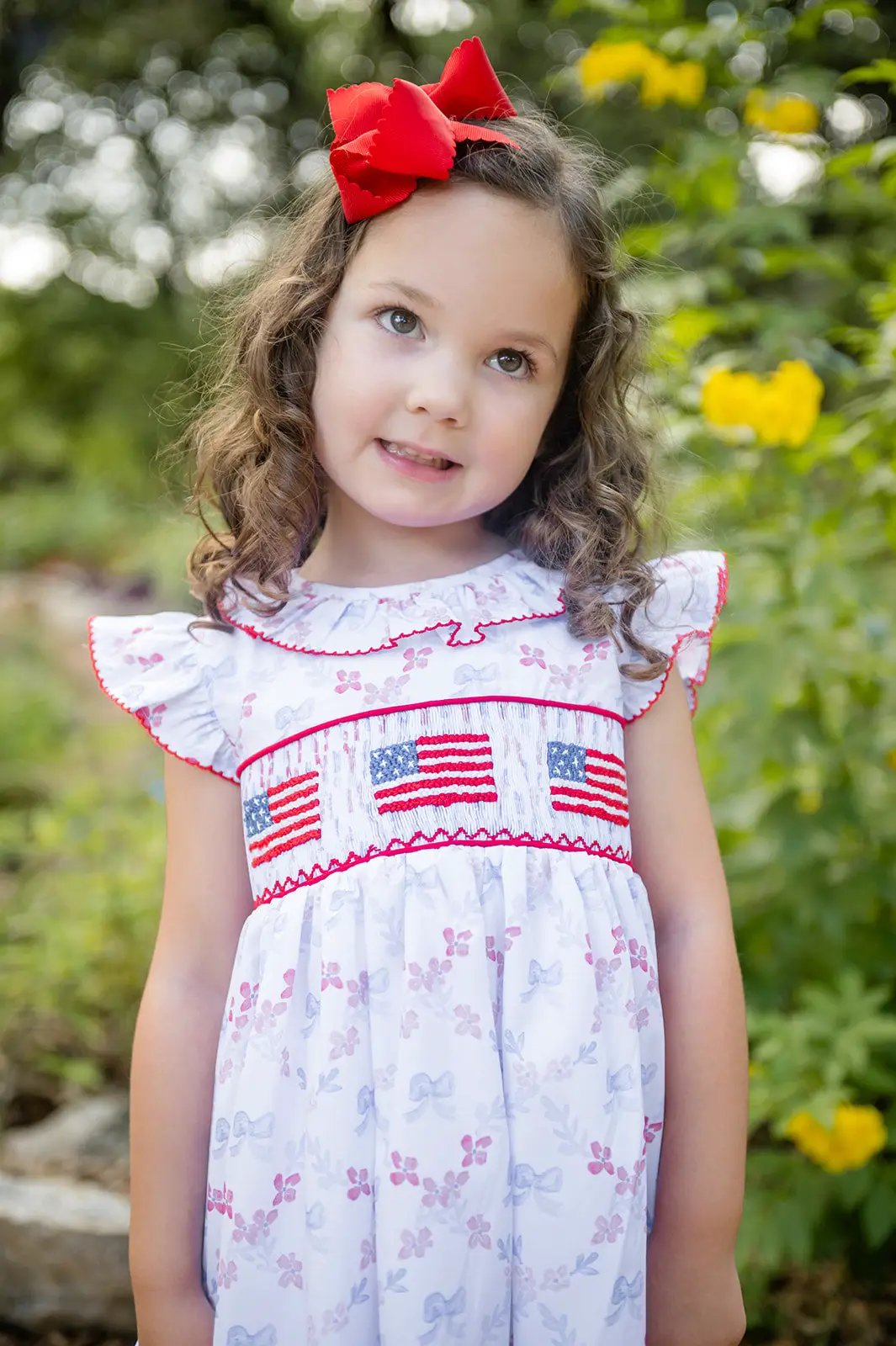 Shop Teeta Girls Ally Dress - Patriotic Bows Print - Smocked USA Flags
