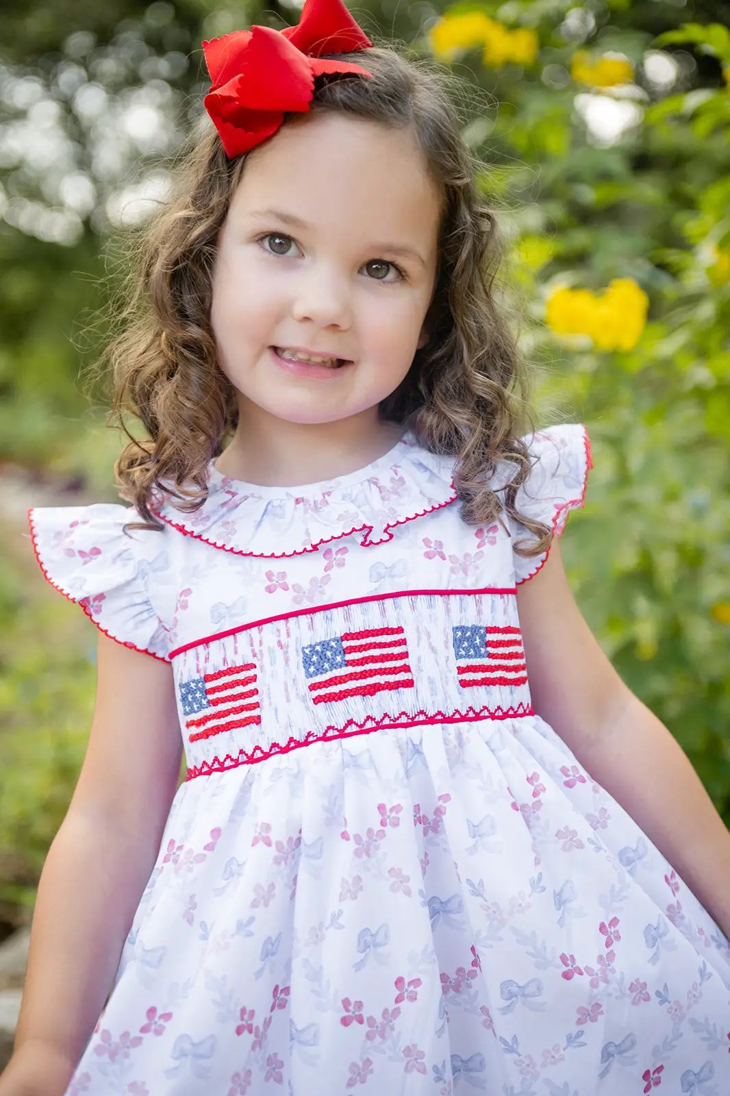 Shop Teeta Girls Ally Dress - Patriotic Bows Print - Smocked USA Flags