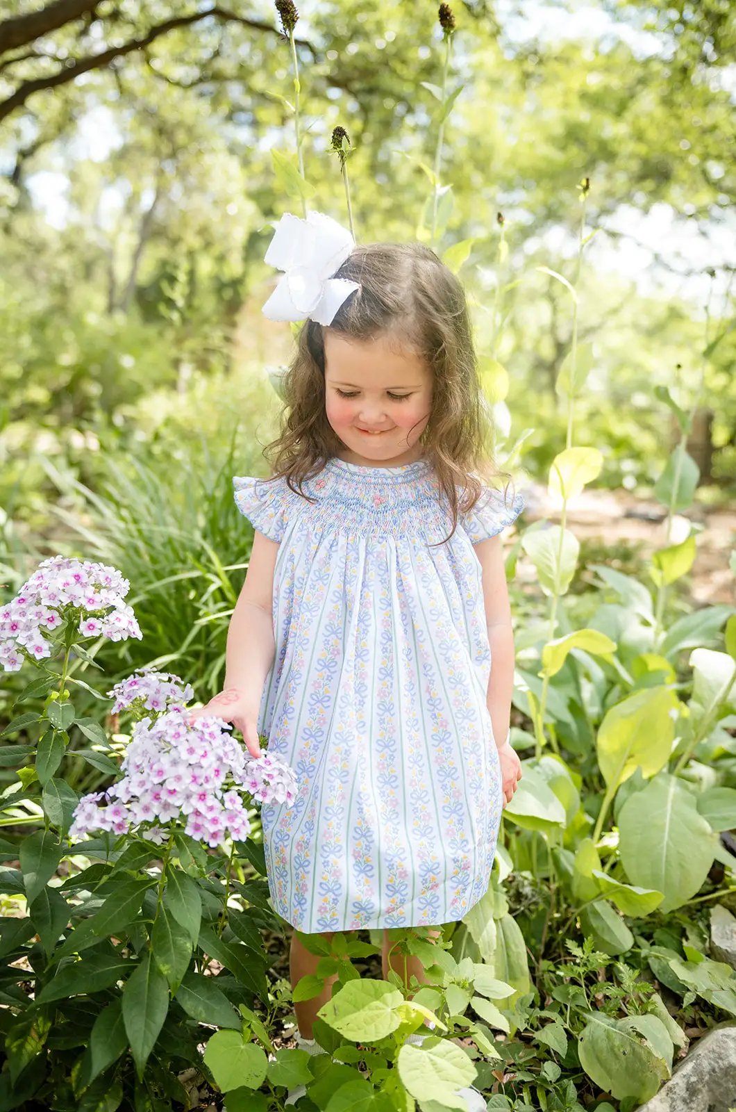 Shop Teeta Girls Smocked Dress - Blue Floral and Pink Bows Print by Shop Teeta