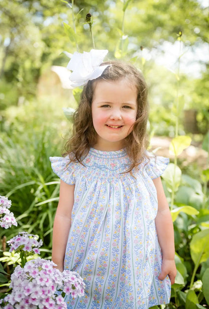 Shop Teeta Girls Smocked Dress - Blue Floral and Pink Bows Print by Shop Teeta