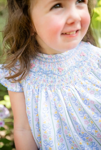 Shop Teeta Girls Smocked Dress - Blue Floral and Pink Bows Print by Shop Teeta