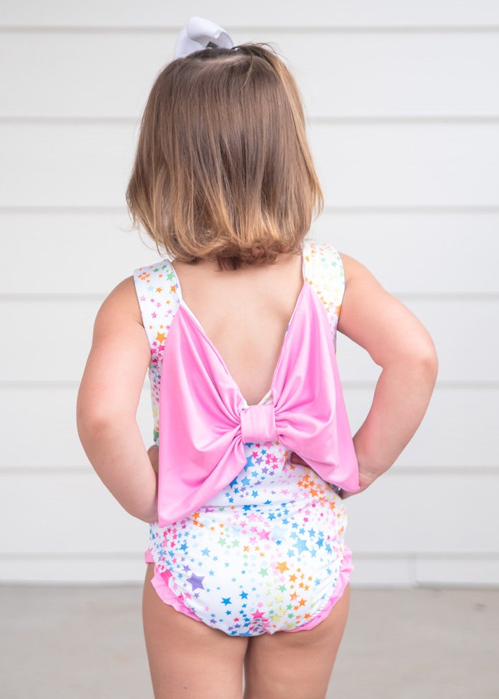 James & Lottie Girls Lottie Swimsuit - Colorful Stars - Pink Bow on Back