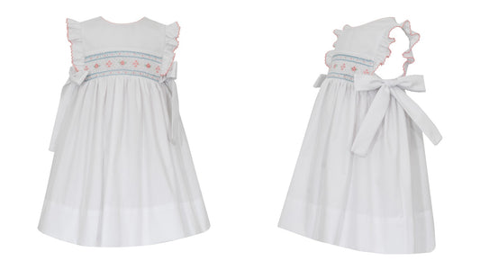 Petit Bebe Girls White Poplin Sleeveless Smocked Dress - Bows at Sides by Petit Bebe